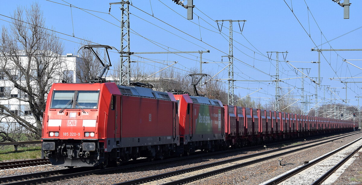 DB Cargo AG, Mainz [D] mit der Doppeltraktion  185 320-9  [NVR-Nummer: 91 80 6185 320-9 D-DB] +  185 205-2  [NVR-Nummer: 91 80 6185 205-2 D-DB] und dem Erzzug am 02.05.24 Höhe Bahnhof Golm (Potsdam).