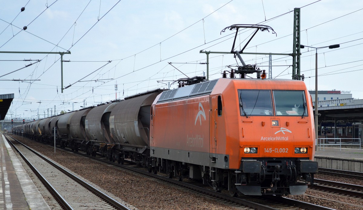 EKO-Trans/Arcelor 145-CL 002/145 082-4 mit dem üblichen Braunkohlestaubzug bei der Durchfahrt Bhf. Flughafen Berlin-Schönefeld, 11.04.14