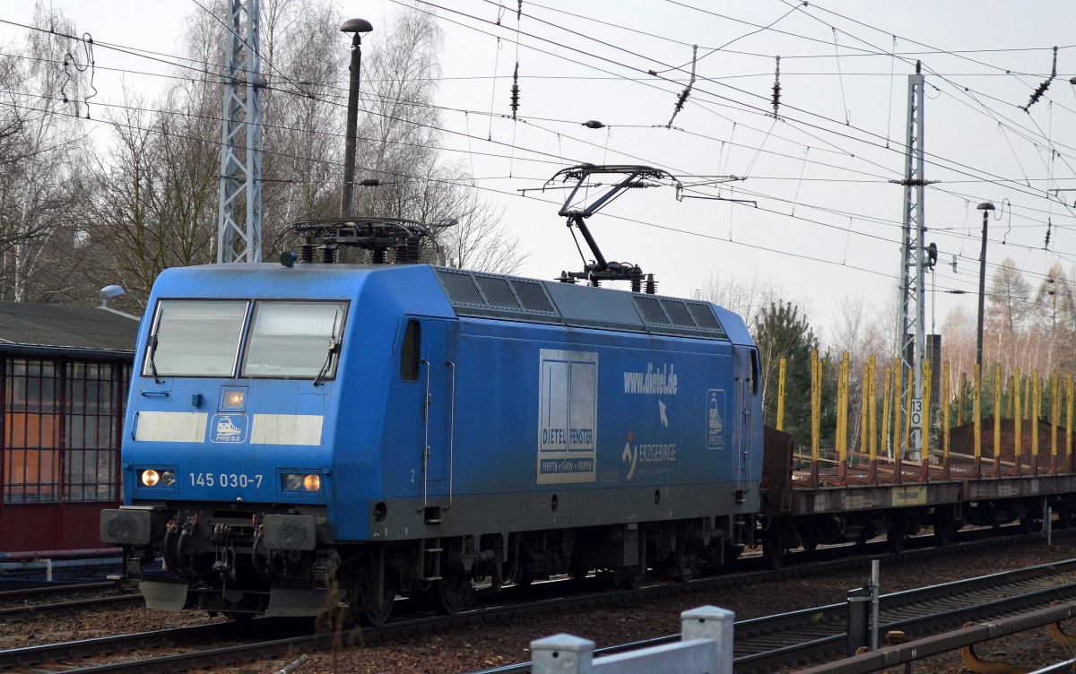 PRESS 145 030-7 (145 085-7) mit Leerzug Transportwagen für Stammholz am 01.03.16 Berlin-Hirschgarten.