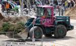 Bei der Neugestaltung des Platzes rund um den Berliner Fernsehturm im Einsatz, dieser eigenwillig gef�rbte VOLVO Radlader Typ L90D der Fa.Hartmann GmbH, 09.07.12 Berlin-Alexanderplatz.
