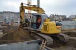 Ein NEW HOLLAND KOBELCO E135SR Raupenbagger der Fa.
