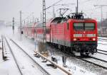 RE4 Richtung Wittenberge mit 114 027-6, n�chster halt Berlin-Jungfernheide, 03.12.10 Berlin Beusselstr.