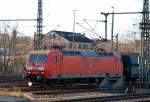 145 064-2 mit Ganzzug polnischer Sch�ttgutwagen Richtung Berlin-Wedding am 28.12.12 H�he Berliner Westhafen.
