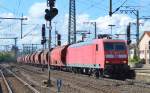 145 045-1 mit Ganzzug gedeckter Sch�ttgutwagen bei der Durchfahrt Bhf.