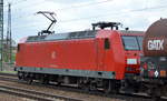 145 065-9 mit Kesselwagenzug im Bf.Flughafen Berlin-Schönefeld.