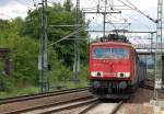 155 201-7 mit Ganzzug polnischer Sch�ttgutwagen bei der Durchfahrt im Bhf.