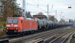 185 033-8 mit einem Kesselwagenzug (leer) Richtung Gbf.