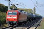 Doppeltraktion 185 372-0 + 185 396-9 mit Ganzzug Schüttgutwagen (Erzbefüllung) am 06.10.14 Berlin-Hohenschönhausen.