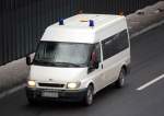 Ein FORD Transit Krankentransporter ganz in Wei� ohne Firmenlogo, 10.12.10 Berliner Stadtautobahn H�he Kaiserdamm.