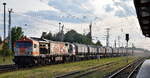 Havelländische Eisenbahn AG, Berlin-Spandau (HVLE) mit ihrem Tiger  V330.8  (NVR:  92 80 1250 009-8 D-HVLE 9 und einem Schüttgutwagenzug für Kaolin (leer) am 03.06.25 Höhe Bahnhof Stendal Hbf.