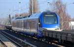 Fabrikneuer dreiteiliger FLIRT (94 80 1427 004-5 D-BOBy) für die Bayerische Oberlandbahn GmbH bei der Überführungsfahrt vom Stadler Werk Berlin Pankow am 05.02.14 in Berlin-Karow.