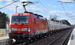 DB Cargo AG, Mainz [D] mit ihrer Vectron  193 561  [NVR-Nummer: 91 80 6193 561-8 D-DB] und Ganzzug innofreigt Schüttgutbehälter für Kalktransporte kurz vor Ziltendorf EKO Höhe