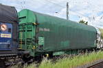Drehgestell-Flachwagen mit vier Rads�tzen, verschiebbarem Planenverdeck und Lademulden f�r Coil-/Spaltbandtransporte vom Einsteller On Rail GmbH mit der Nr. 37 TEN 80 D-ORME 4677 070-7 Shimmns 287 in einem Coilzug am 21.05.26 H�he Magdeburg-Neustadt. 