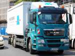 Ein MAN TGS 26.360 Wechselbeh�lter-Tr�ger mit Spezialaufsatz f�r Rohstoffverwertung der Fa.
