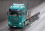 MAN TGA Sattelzug mit Flachauflieger der Fa.SPT aus Berlin, 24.01.11 Berliner Stadtautobahn H�he Knobelsdorffbr�cke.