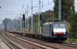�berraschender Zug in Berlin-Karow, eine MRCE Mietlok ES 64 F4-101 (91 80 6189 101-? D-DISPO I-SAD, Siemens Bj.2009) m�glicherweise von LOCON mit einem Leerzug Containertragwagen Richtung Karower