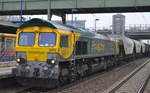 Die deutsche FPL-Lok 66012 (266 039-7) mit einem langen Getreidezug (leer) Richtung Mukran am 25.01.17 Bf.