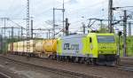 ATC Mietlok 185 534-5 für CFL Cargo tätig mit einem Warsteiner Containerzug bei der Durchfahrt im Bhf.