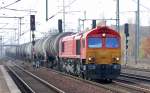 HGK Lok DE677 (92 80 1266 107-2 D-HGK) mit Kesselwagenganzzug, 25.10.11 Durchfahrt im Bhf.