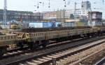 Drehgestell-Flachwagen mit Seitzenborden vom Einsteller HVLE mit der Nr.