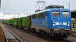 PRESS 140 041-5 (140 810-3) mit Holzzug bei der Durchfahrt Bhf.