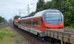 Unnummerierter fabrikneuer vierteiliger STADLER FLIRT der BR 428 für die DB Regio am 23.06.14 bei der Überführungfahrt durch hvle V160.6 bei der Ausafhrt Bhf.